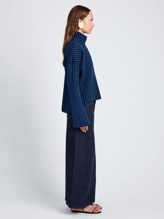 Proenza Schouler Side full length image of model wearing Elysia Sweater in Ladder Stripe Knits in BlueBlack