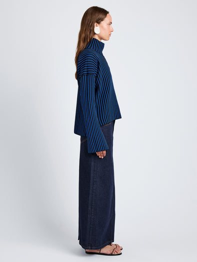 Proenza Schouler Side full length image of model wearing Elysia Sweater in Ladder Stripe Knits in BlueBlack