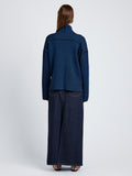 Proenza Schouler Back full length image of model wearing Elysia Sweater in Ladder Stripe Knits in BlueBlack