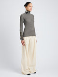Proenza Schouler Side full length image of model wearing Yasmine Sweater in Multi Stripe Knit in IvyWhite