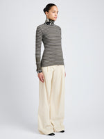 Proenza Schouler Side full length image of model wearing Yasmine Sweater in Multi Stripe Knit in IvyWhite