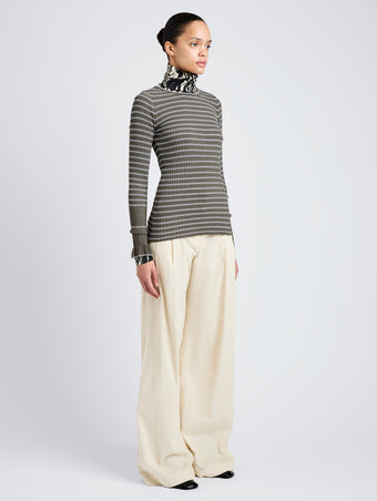 Proenza Schouler Side full length image of model wearing Yasmine Sweater in Multi Stripe Knit in IvyWhite