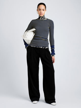 Proenza Schouler Front full length image of model wearing Yasmine Sweater in Multi Stripe Knit in NavyYellow