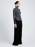 Proenza Schouler Side full length image of model wearing Yasmine Sweater in Multi Stripe Knit in NavyYellow