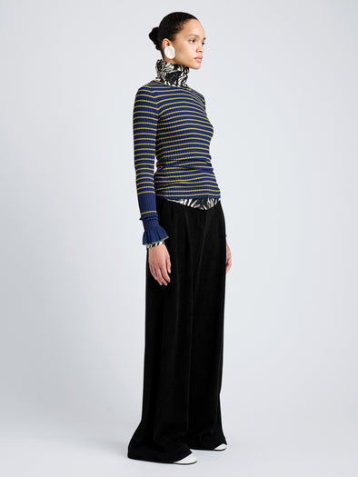 Proenza Schouler Side full length image of model wearing Yasmine Sweater in Multi Stripe Knit in NavyYellow
