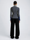 Proenza Schouler Back full length image of model wearing Yasmine Sweater in Multi Stripe Knit in NavyYellow