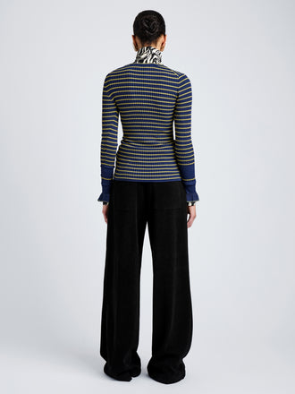 Proenza Schouler Back full length image of model wearing Yasmine Sweater in Multi Stripe Knit in NavyYellow