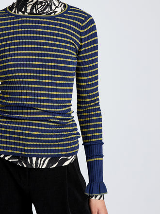 Proenza Schouler Detail image of model wearing Yasmine Sweater in Multi Stripe Knit in NavyYellow