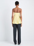 Proenza Schouler Back full length image of model wearing Avine Top in Rumpled Cotton in Straw Multi