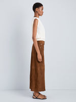 Proenza Schouler Side full length image of model wearing Nayah Skirt in Textured Suede in Tobacco
