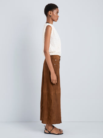 Proenza Schouler Side full length image of model wearing Nayah Skirt in Textured Suede in Tobacco