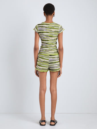 Proenza Schouler Back full length image of model wearing Jenna Knit Shorts in Linen Dry Rib in Apple Multi