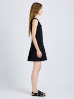 Proenza Schouler Side full length image of model wearing Kaida Dress in Basketweave Tweed in Black