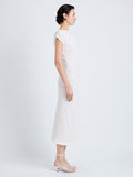 Proenza Schouler Side full length image of model wearing Astra Dress in Stretch Lace in Alabaster