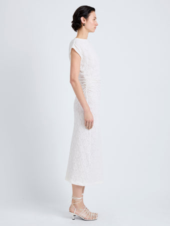 Proenza Schouler Side full length image of model wearing Astra Dress in Stretch Lace in Alabaster