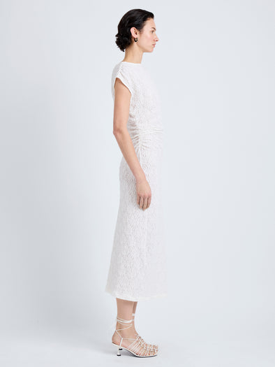 Proenza Schouler Side full length image of model wearing Astra Dress in Stretch Lace in Alabaster