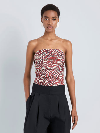 Proenza Schouler Front cropped image of model wearing Maisy Strapless Top in Poplin in Rust Cream Multi