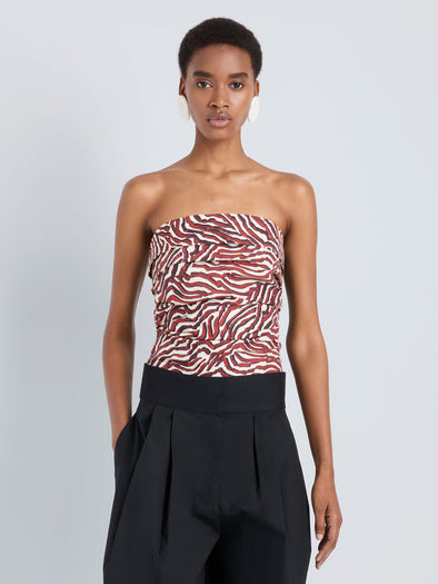 Proenza Schouler Front cropped image of model wearing Maisy Strapless Top in Poplin in Rust Cream Multi