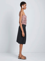 Proenza Schouler Side full length image of model wearing Maisy Strapless Top in Poplin in Rust Cream Multi