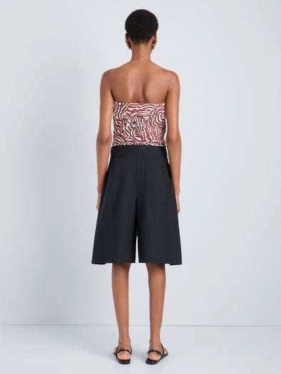 Proenza Schouler Back full length image of model wearing Maisy Strapless Top in Poplin in Rust Cream Multi