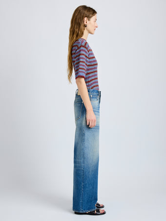 Proenza Schouler Side full length image of model wearing Dana Sweater in Stripe Knit in Periwinkle Stripe