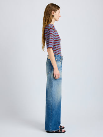 Proenza Schouler Side full length image of model wearing Dana Sweater in Stripe Knit in Periwinkle Stripe