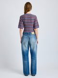 Proenza Schouler Back full length image of model wearing Dana Sweater in Stripe Knit in Periwinkle Stripe