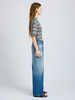 Proenza Schouler Side full length image of model wearing Dana Sweater in Stripe Knit in Willow Stripe