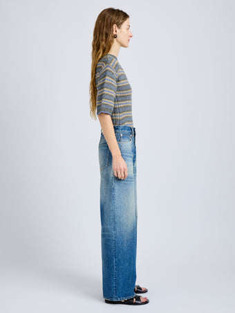 Proenza Schouler Side full length image of model wearing Dana Sweater in Stripe Knit in Willow Stripe