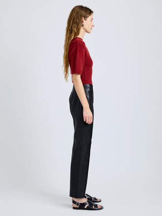 Proenza Schouler Side full length image of model wearing Dana Sweater in Stripe Knit in Brick