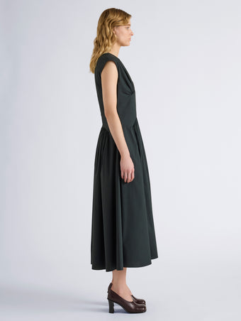 Proenza Schouler Side full length image of model wearing Nyssa Dress in Stretch Cotton in Dark Green
