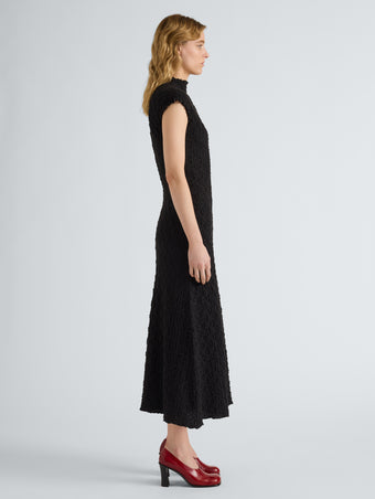 Proenza Schouler Side full length image of model wearing Cleo Dress in Jersey Jacquard in Black