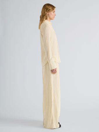 Proenza Schouler Side full length image of model wearing Madi Top in Crushed Velvet in Pale Lemon