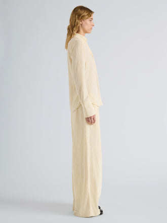 Proenza Schouler Side full length image of model wearing Madi Top in Crushed Velvet in Pale Lemon