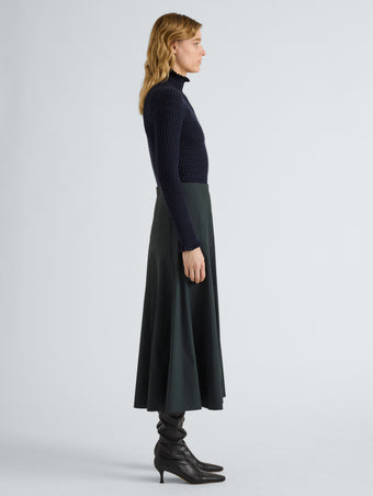 Proenza Schouler Side full length image of model wearing Heidi Skirt in Stretch Cotton in Dark Green