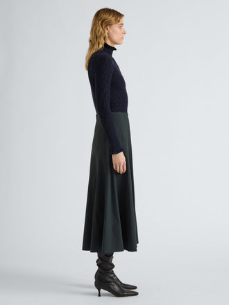 Proenza Schouler Side full length image of model wearing Heidi Skirt in Stretch Cotton in Dark Green