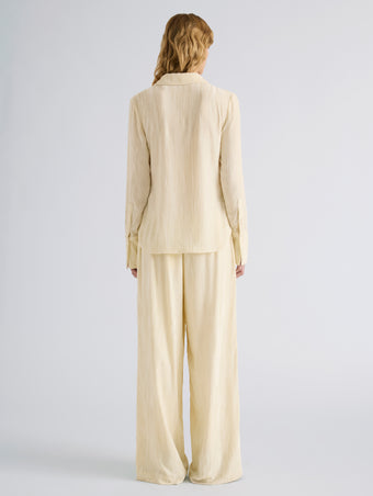 Proenza Schouler Back full length image of model wearing Meadow Pant in Crushed Velvet in Pale Yellow