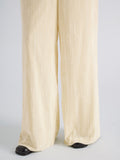 Proenza Schouler Detail image of model wearing Meadow Pant in Crushed Velvet in Pale Yellow