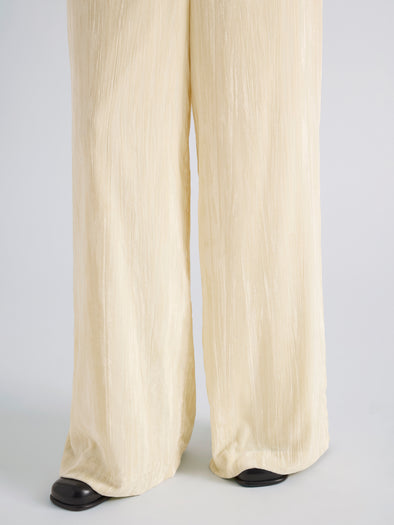 Proenza Schouler Detail image of model wearing Meadow Pant in Crushed Velvet in Pale Yellow