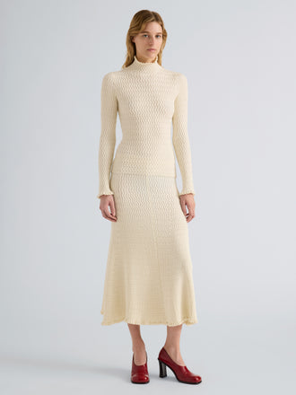 Proenza Schouler Front full length image of model wearing Juniper Sweater in Cable Knit in Vanilla