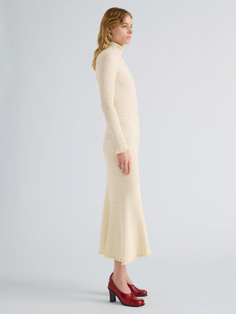 Proenza Schouler Side full length image of model wearing Juniper Sweater in Cable Knit in Vanilla
