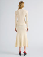 Proenza Schouler Back full length image of model wearing Juniper Sweater in Cable Knit in Vanilla