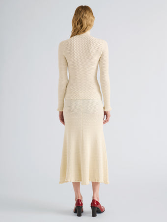 Proenza Schouler Back full length image of model wearing Juniper Sweater in Cable Knit in Vanilla