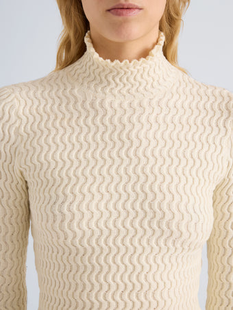 Proenza Schouler Detail image of model wearing Juniper Sweater in Cable Knit in Vanilla