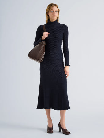 Proenza Schouler Front full length image of model wearing Juniper Sweater in Cable Knit in Navy