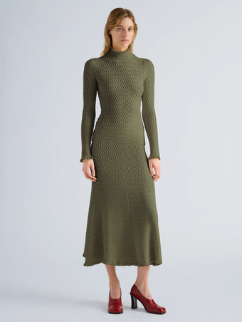 Proenza Schouler Front full length image of model wearing Juniper Sweater in Cable Knit in Dark Olive