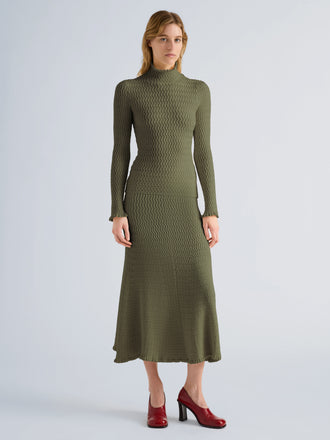 Proenza Schouler Front full length image of model wearing Juniper Sweater in Cable Knit in Dark Olive