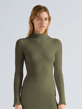 Proenza Schouler Front cropped image of model wearing Juniper Sweater in Cable Knit in Dark Olive