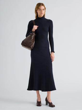 Proenza Schouler Front full length image of model wearing Magnolia Skirt in Cable Knit in Navy