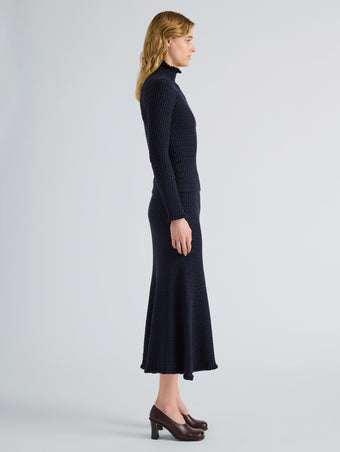 Proenza Schouler Side full length image of model wearing Magnolia Skirt in Cable Knit in Navy